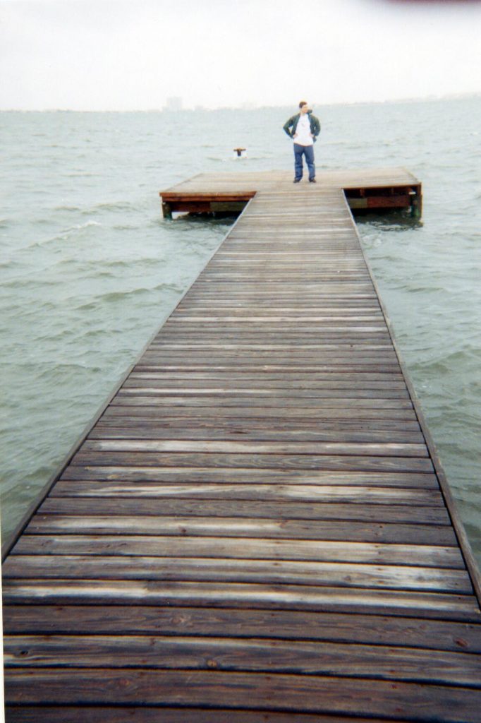 Forrest Masters standing at the end of the dock